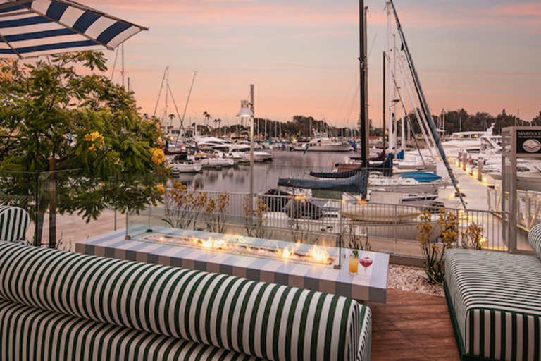 Lounge seating overlooking the marina at sunset