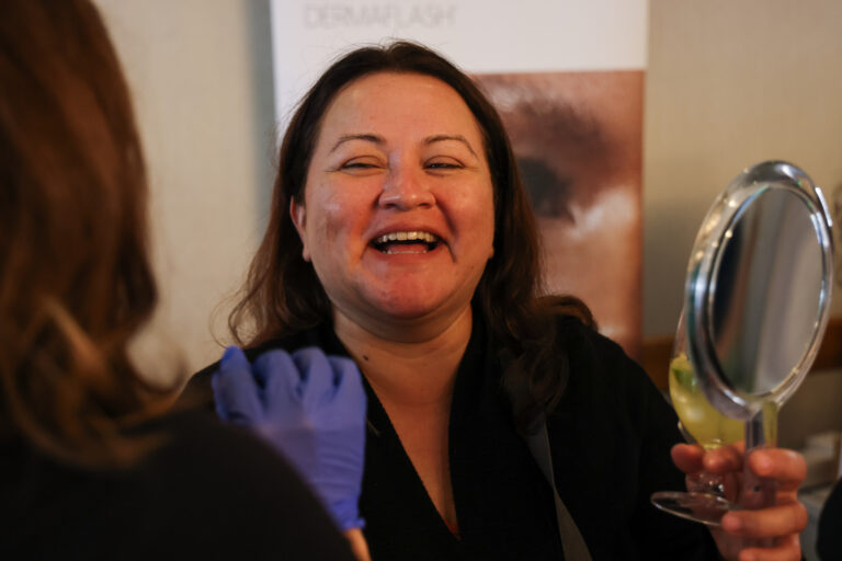 An attendee smiling during a past UST event