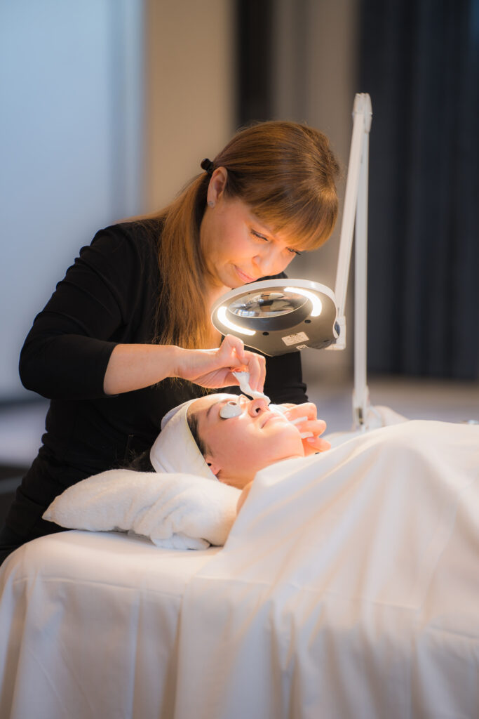 A close-up of hands-on facial work at a past Understanding Skin Tour event